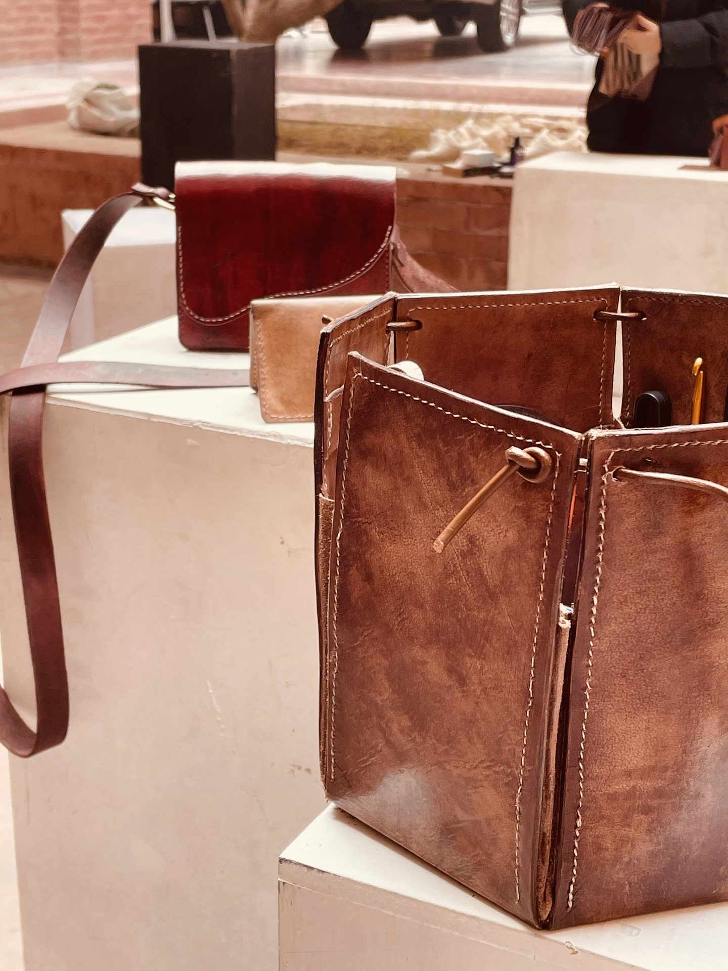 Close view of paired leather pieces on display