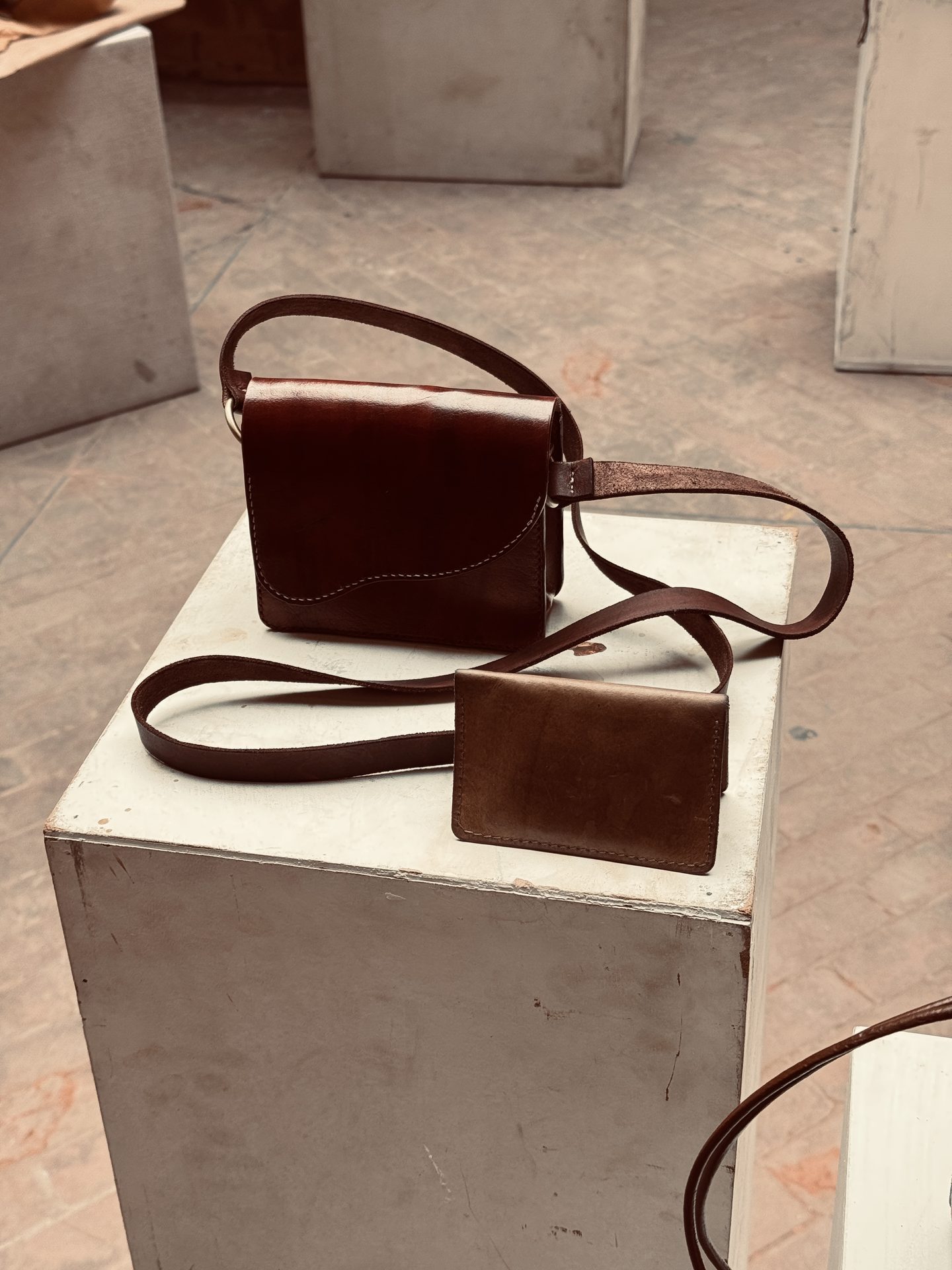 Saddle bag and wallet displayed together