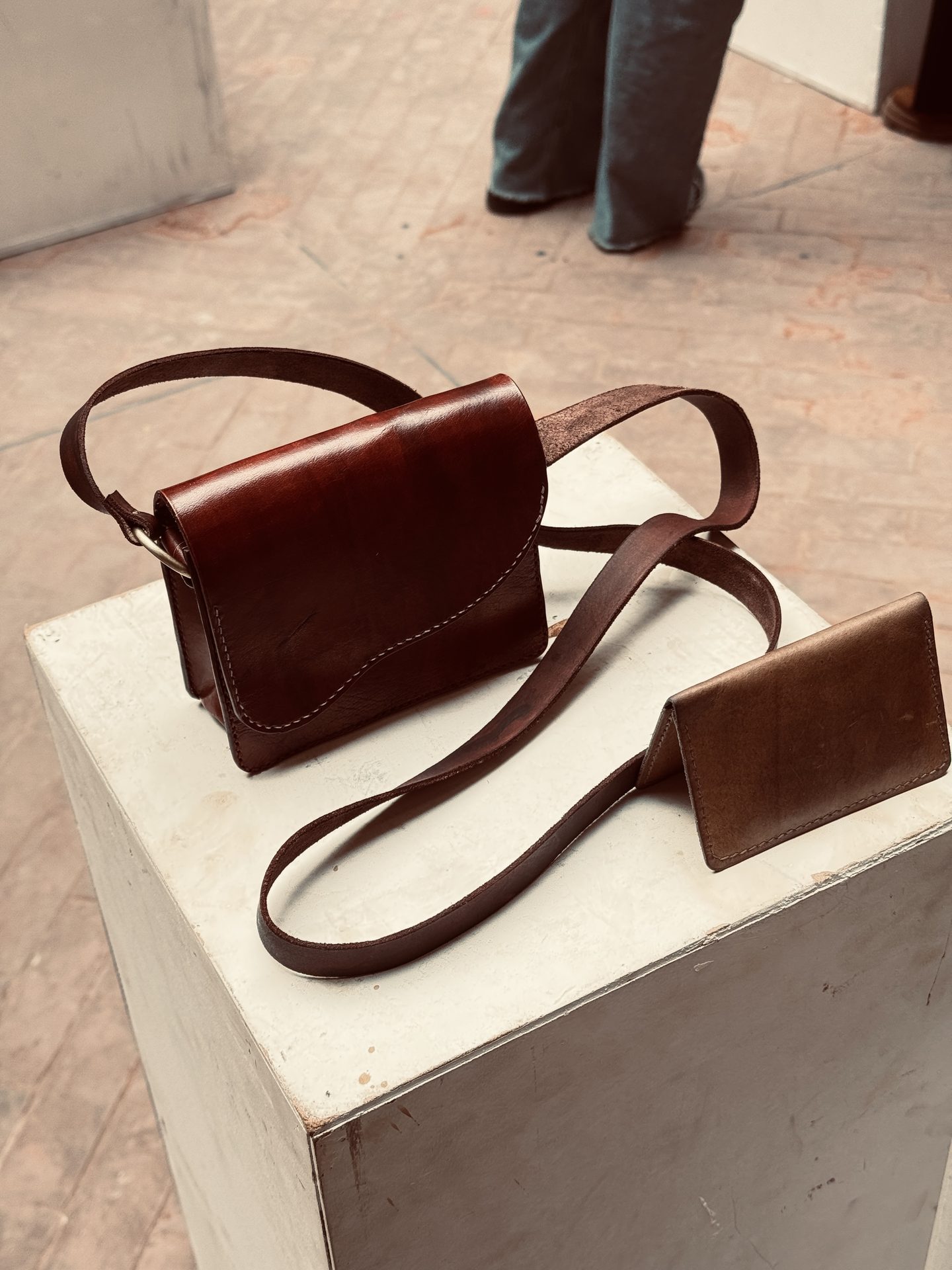 Detail view of saddle bag and wallet on display