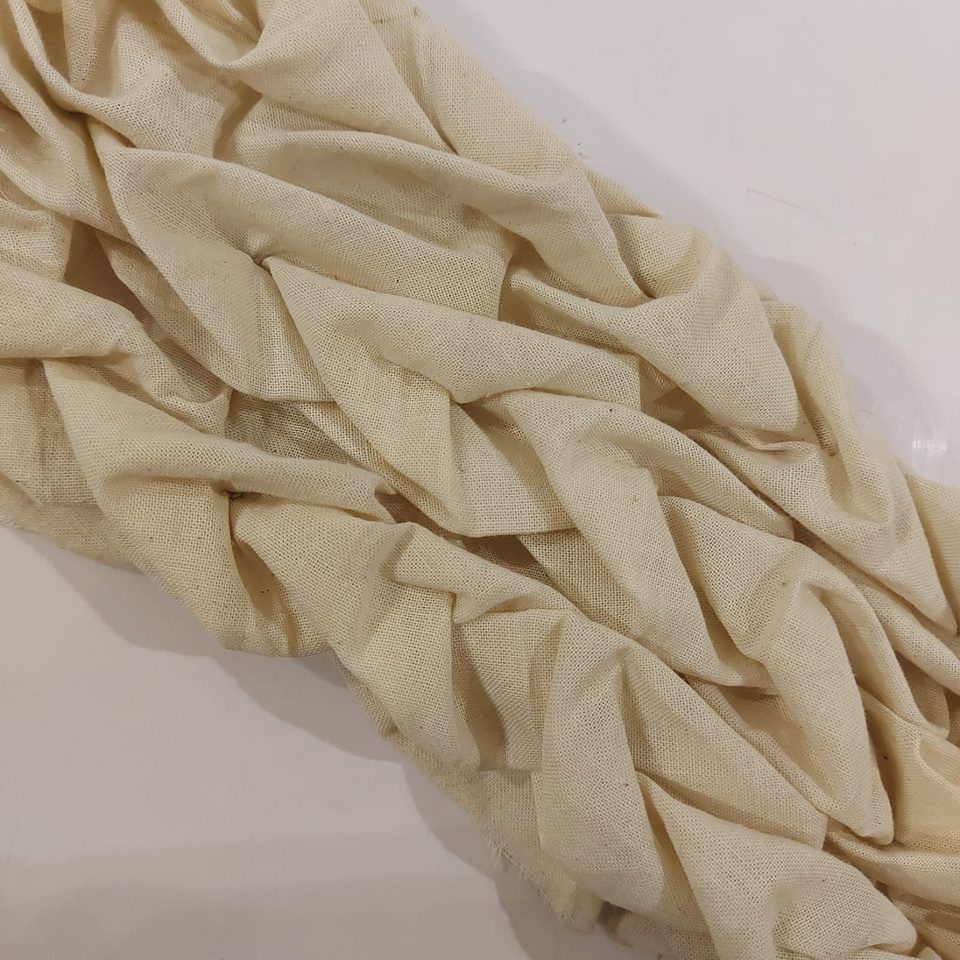 Diagonal woven-effect smocking in calico