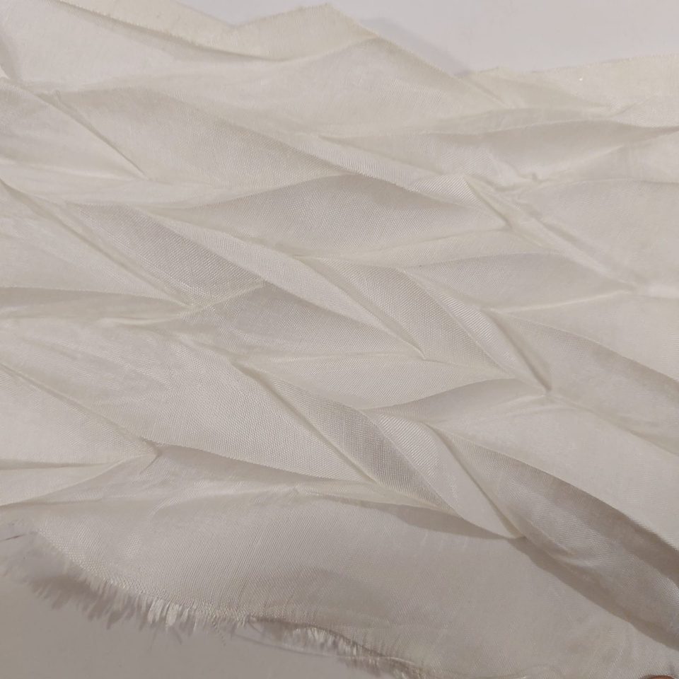 White sheer organza folded into a chevron lattice
