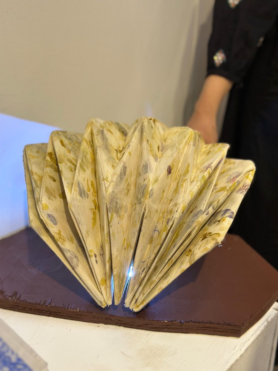 Eco-printed folded fabric light form, lit from within