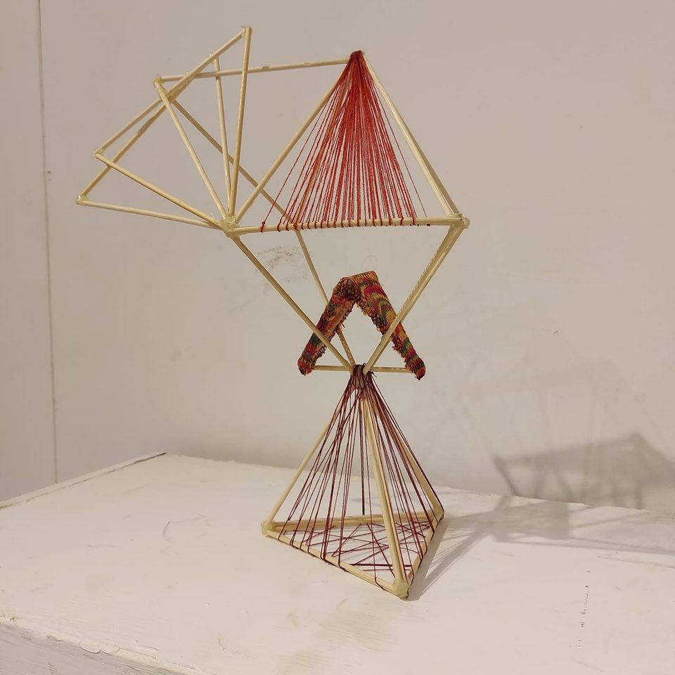Bamboo and thread kinetic structure with woven panel, view one