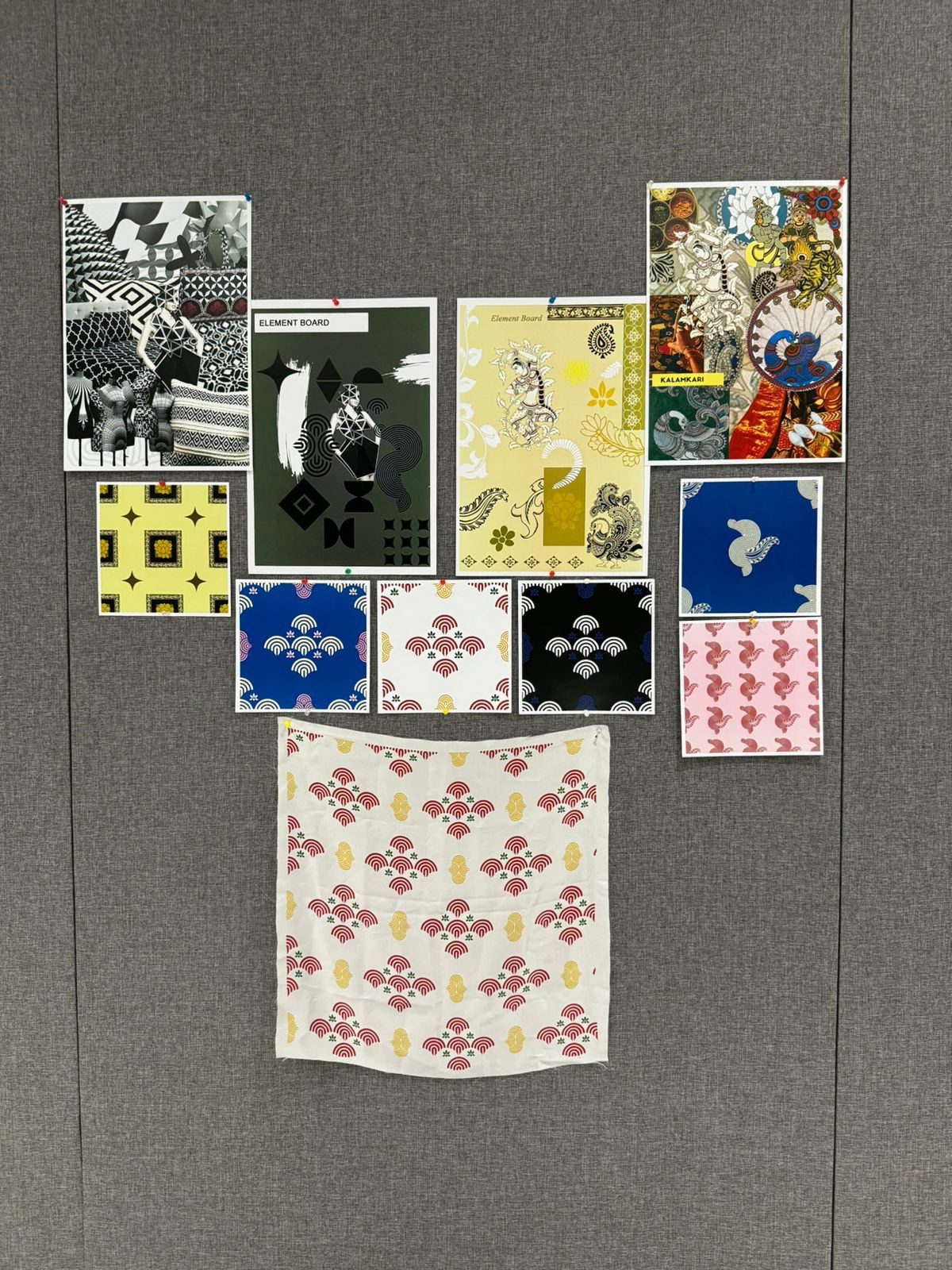 Printed swatches and boards displayed on a pinboard