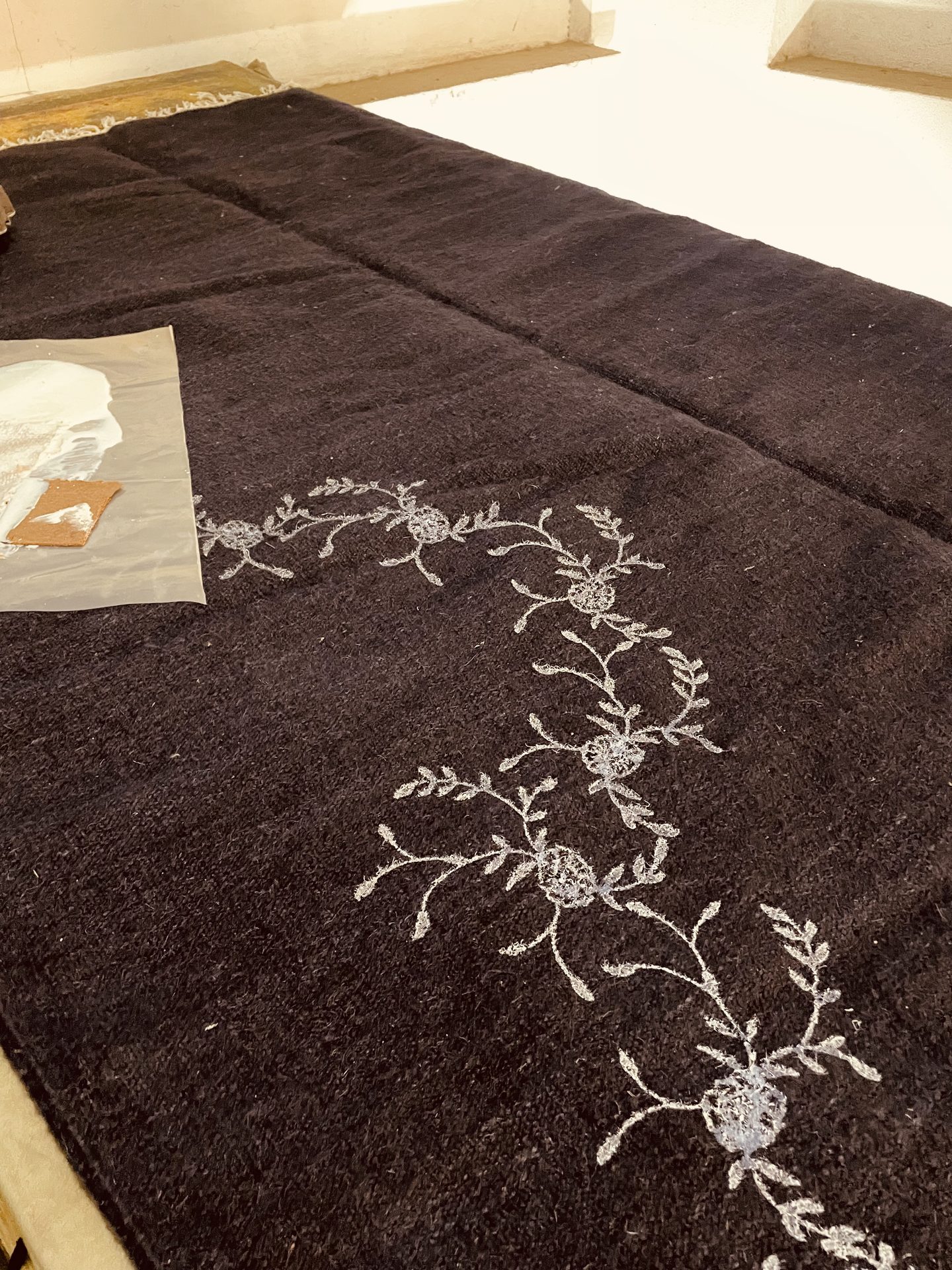 Lotus motif embroidered onto woven cloth
