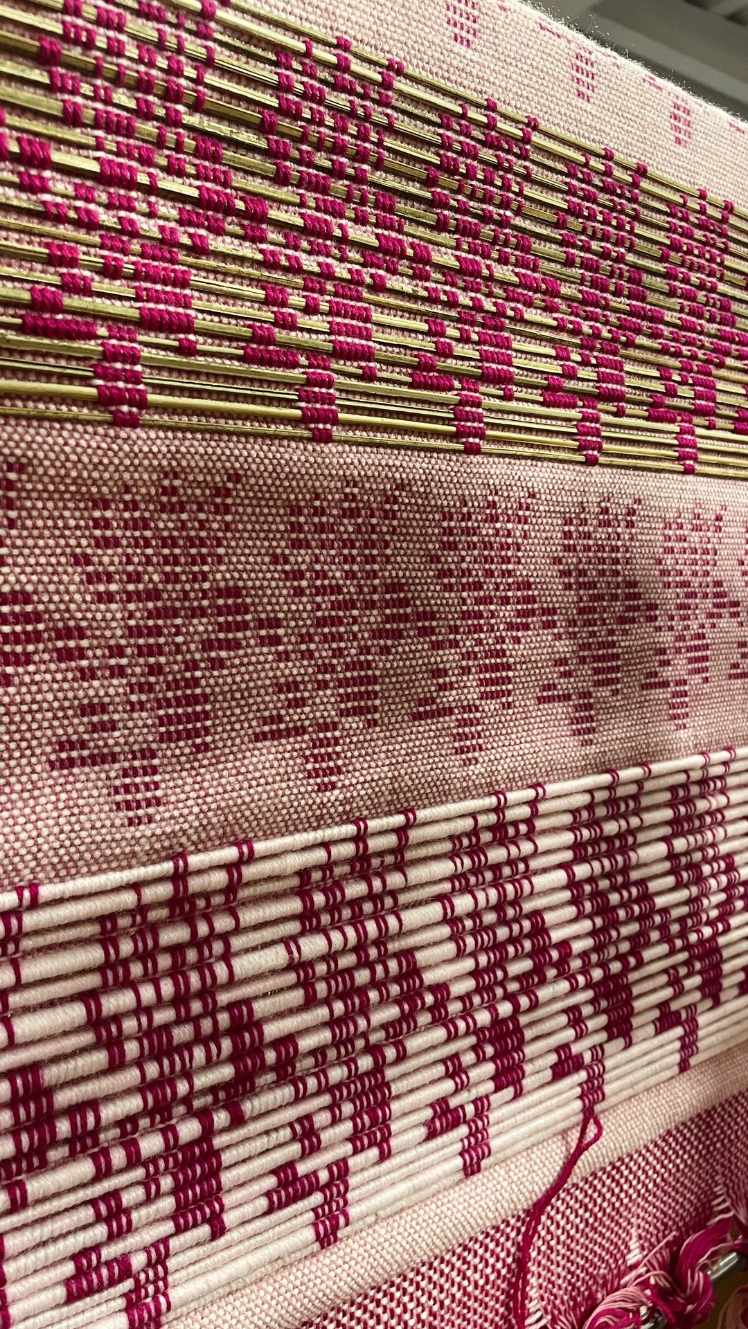 Pink floral jacquard fabric on the loom