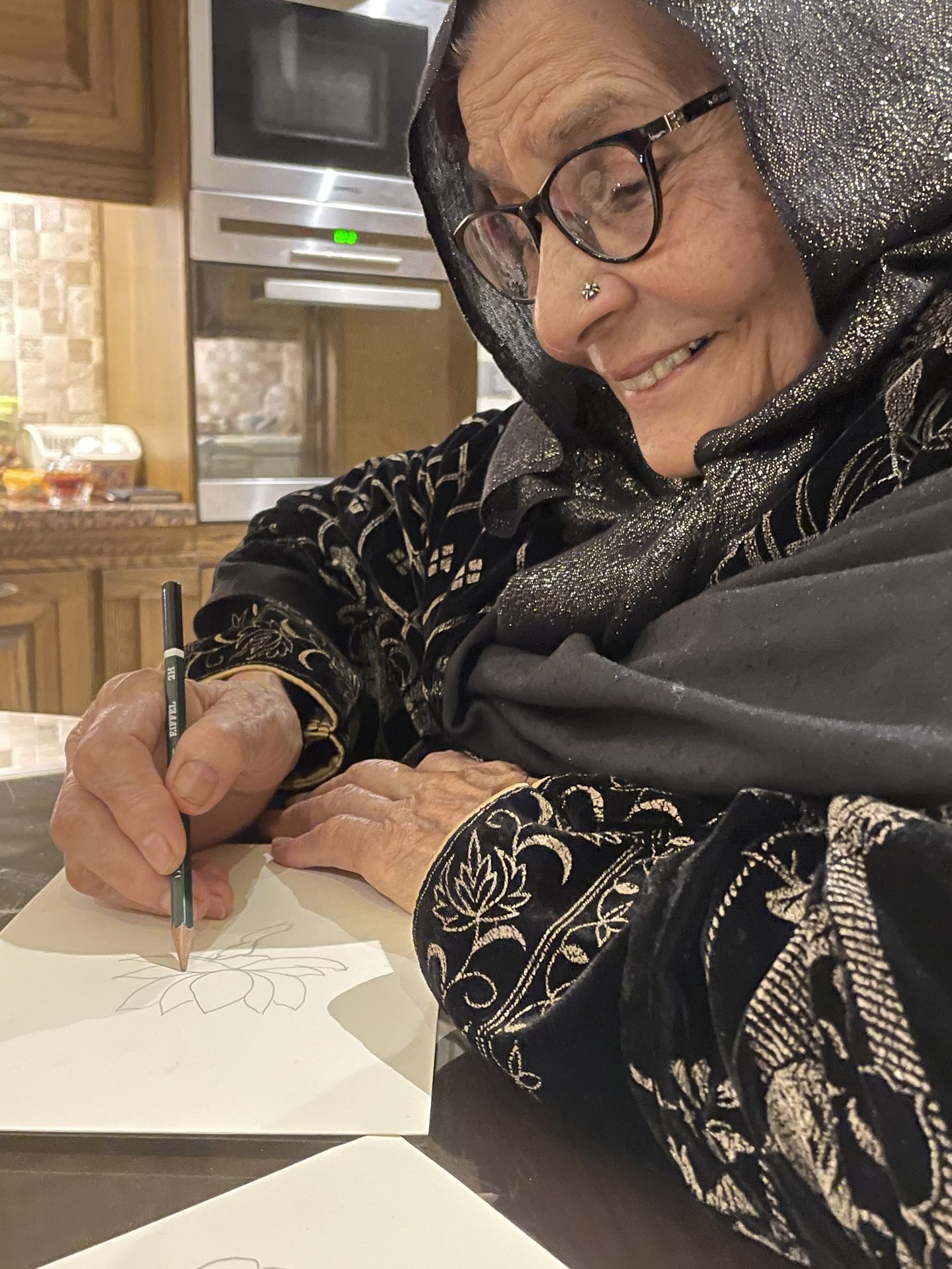 Portrait of the designer's grandmother writing