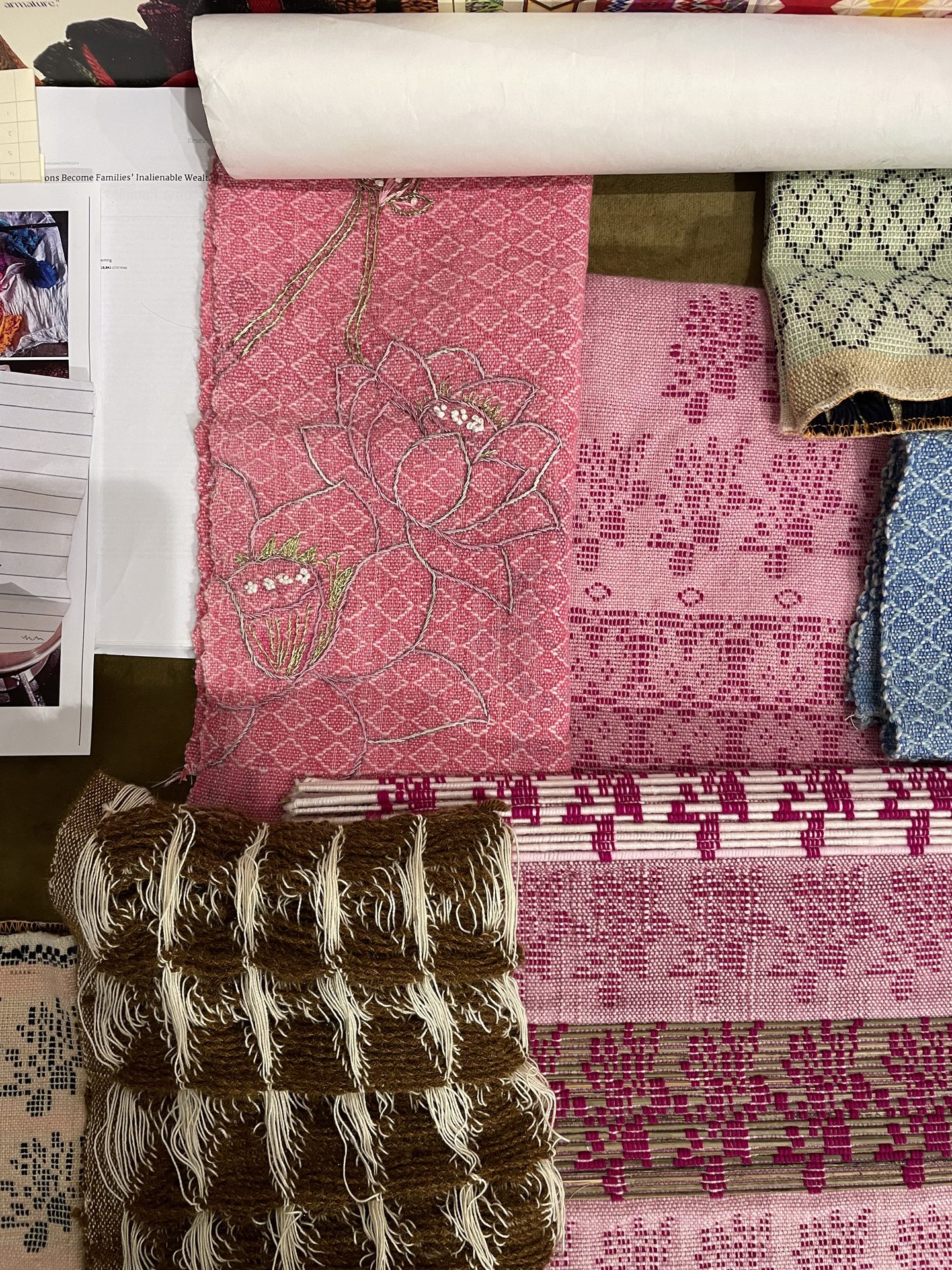Stack of fabric swatches in pink and brown tones