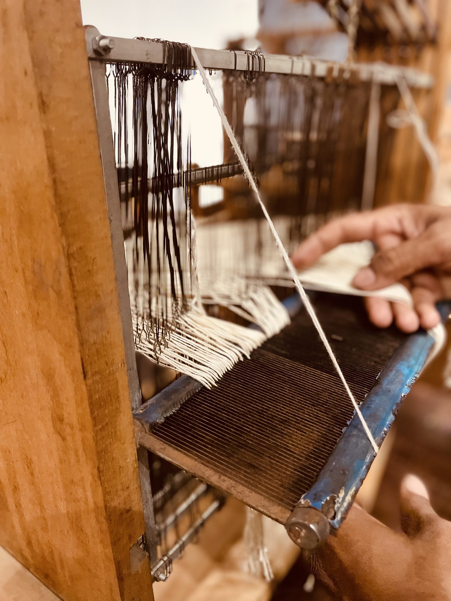 Hand threading the jacquard loom