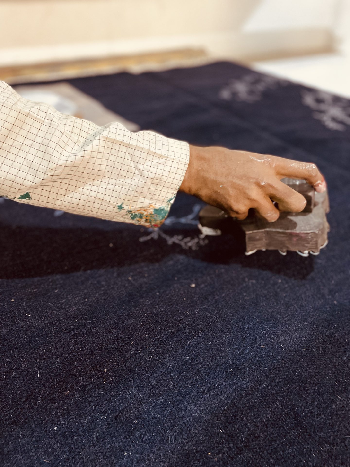 Working an indigo woven cloth by hand